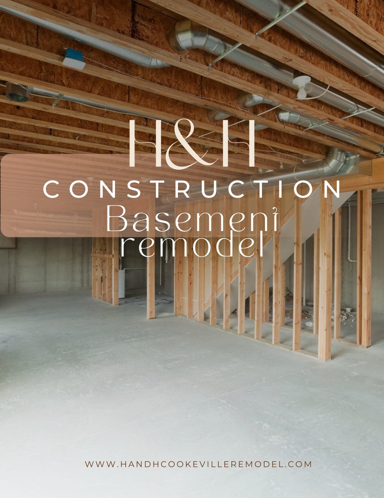 H&H Construction basement remodel in progress with new wood stud framing, exposed floor joists and ductwork over a bare concrete floor